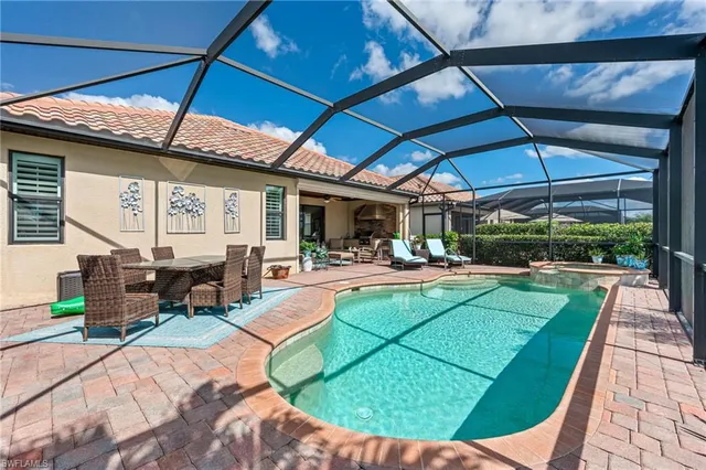 a view of a swimming pool with a patio