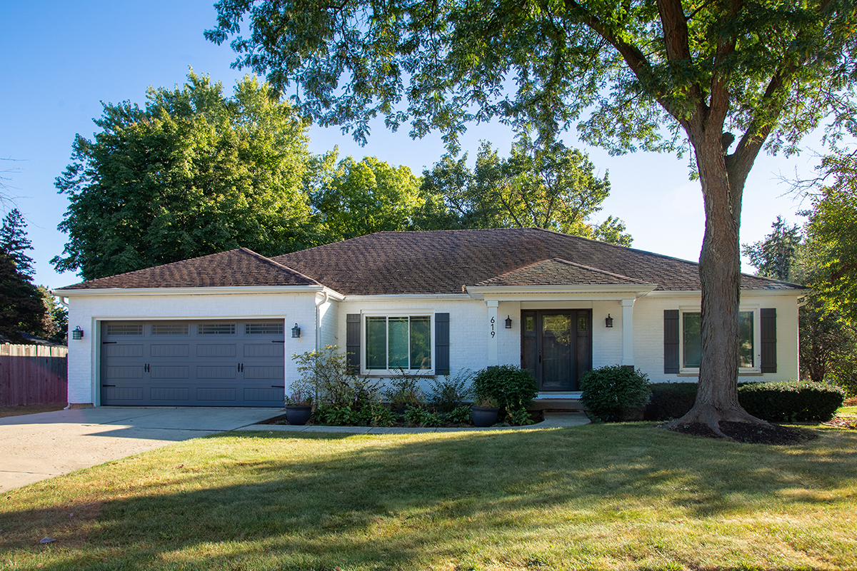 619 West End Road Roselle, IL 60172 - Photo 2 of 37 a view of a house with a yard plants and large tree