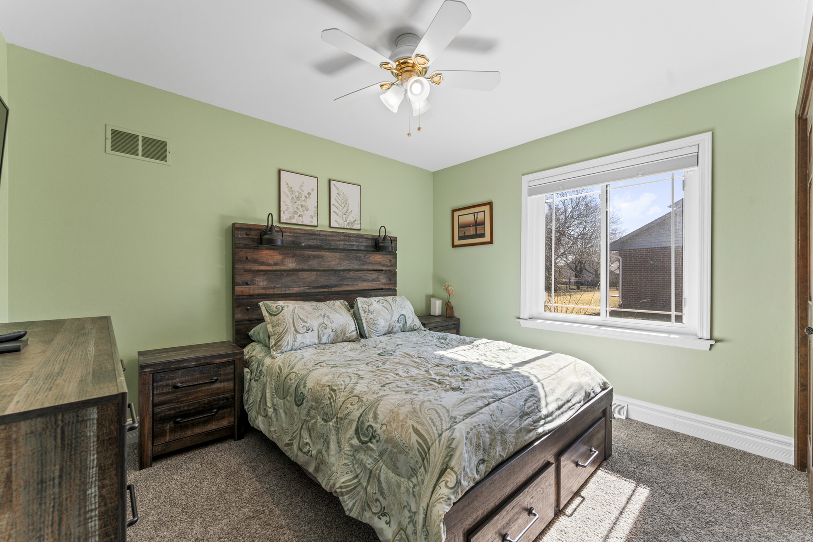 619 West End Road Roselle, IL 60172 - Photo 22 of 37 a bedroom with a bed and a chandelier
