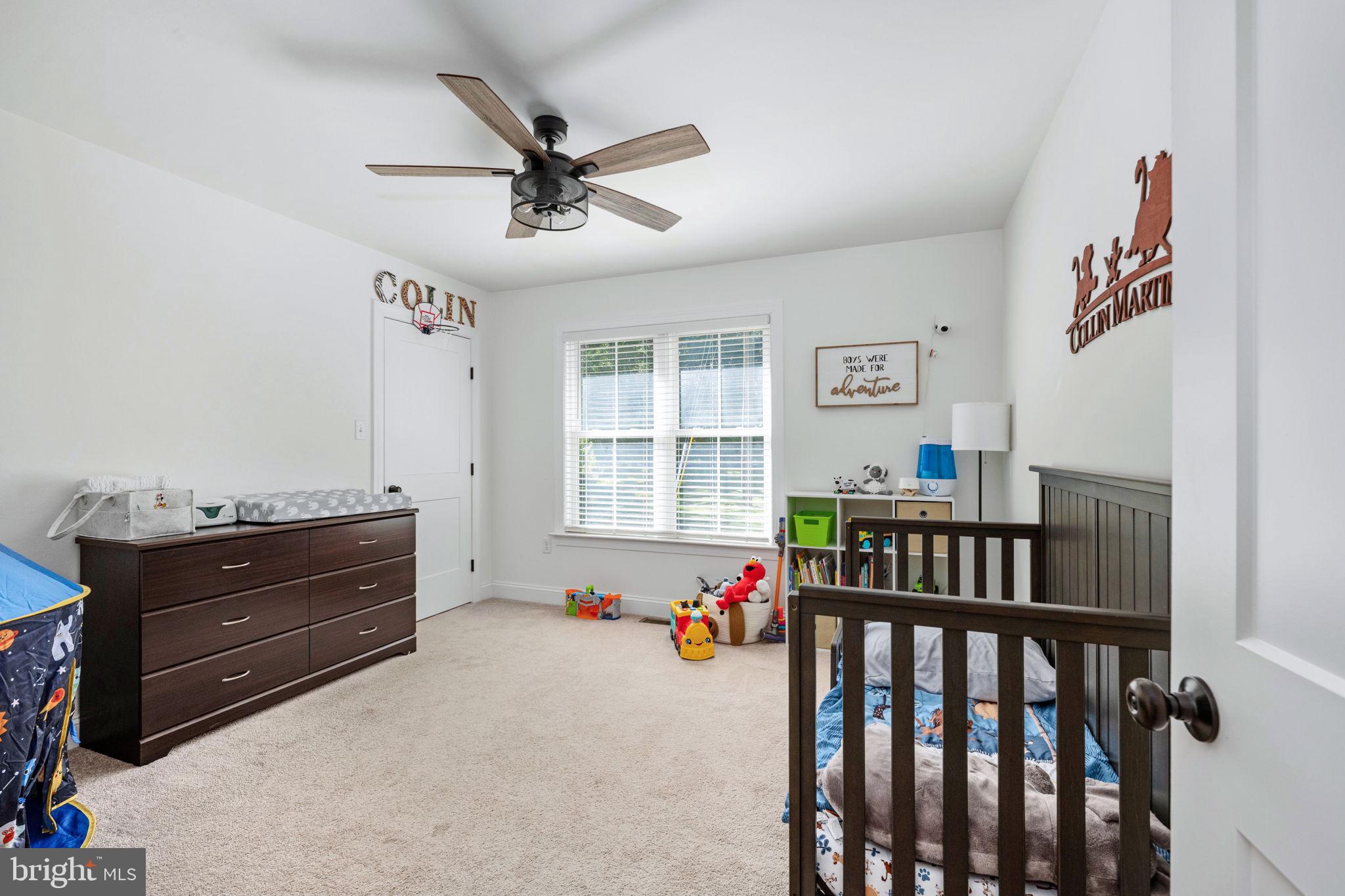 5712 Buckner Road Bumpass, VA 23024 - Photo 26 of 59 a bedroom with furniture and a window
