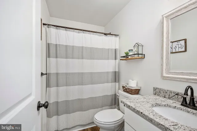 a house view with swimming pool and trees in the background