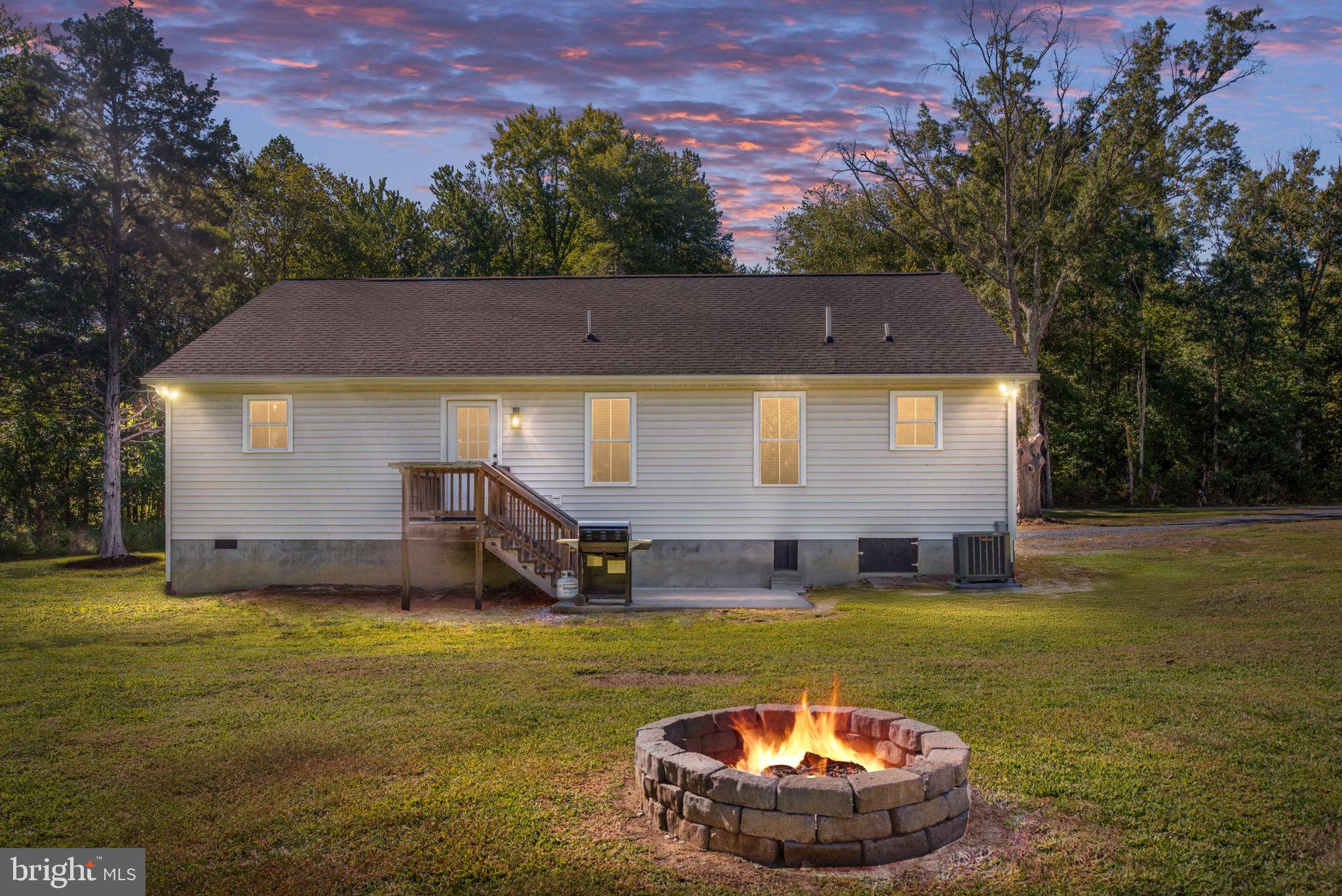5712 Buckner Road Bumpass, VA 23024 - Photo 4 of 59 a view of a house with swimming pool and a yard