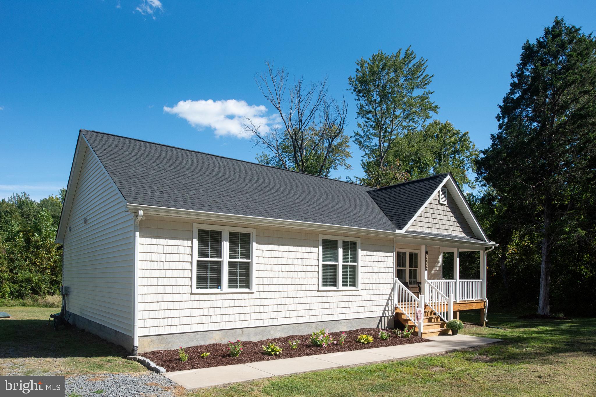 5712 Buckner Road Bumpass, VA 23024 - Photo 55 of 59 a front view of a house with a yard