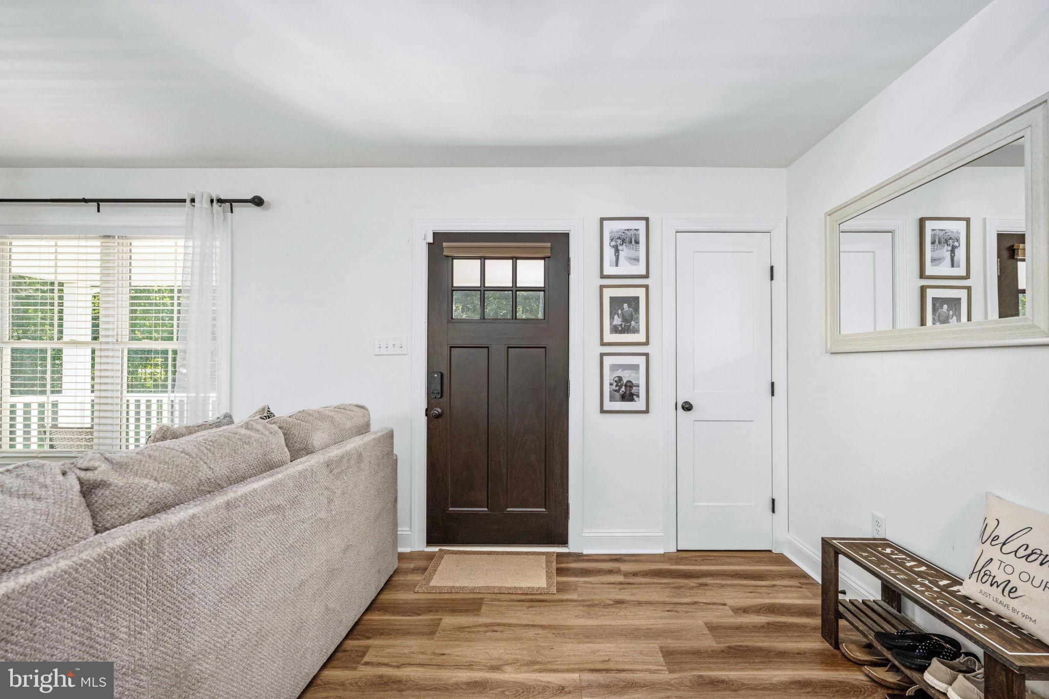 5712 Buckner Road Bumpass, VA 23024 - Photo 9 of 59 a living room with furniture and a window