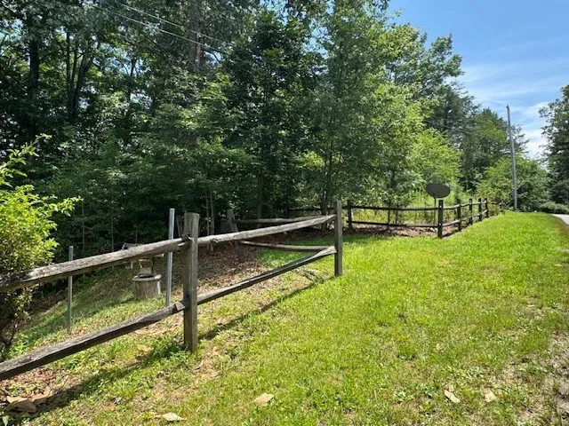 a view of a bench in the backyard