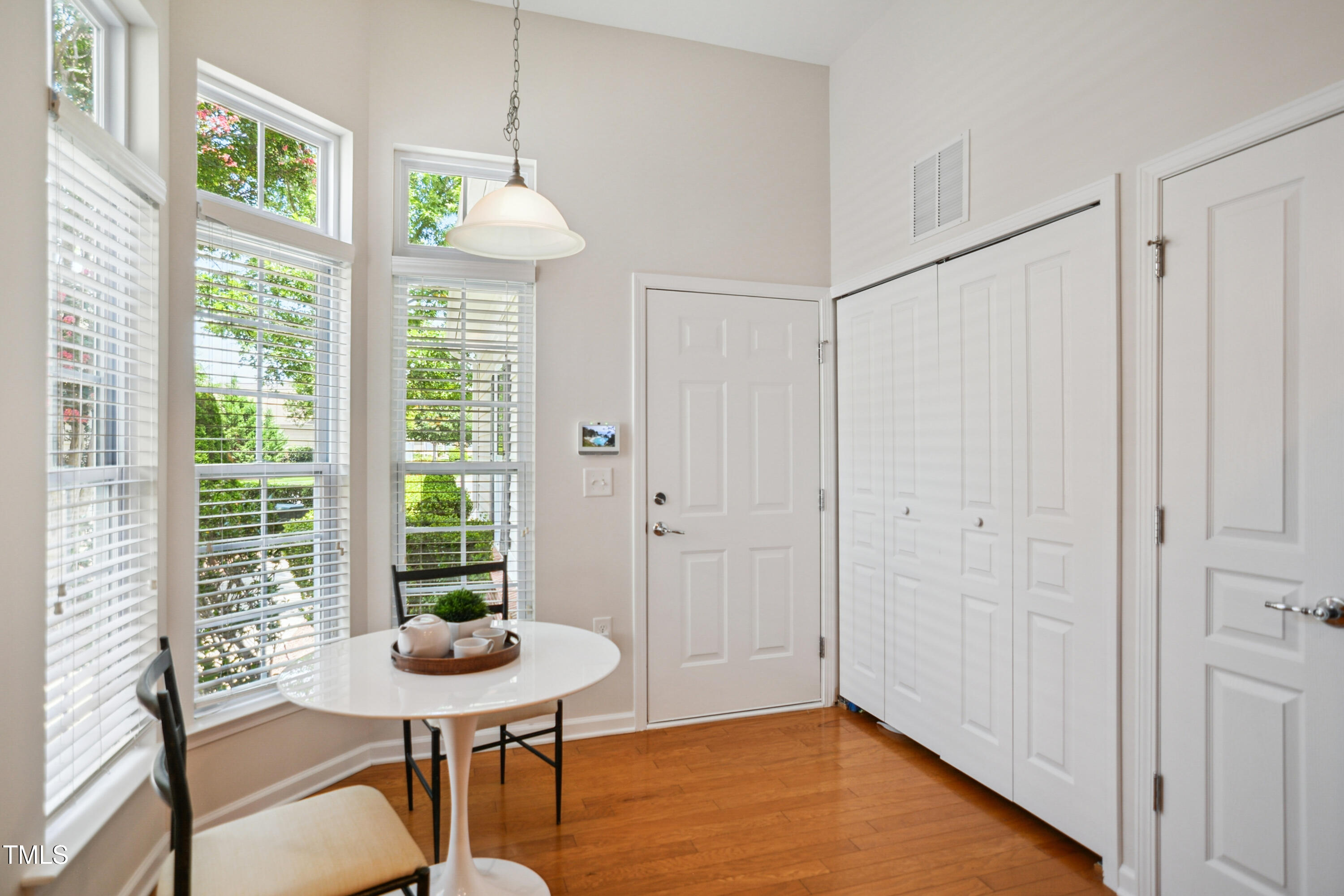 563 Tomkins Loop Cary, NC 27519 - Photo 12 of 26 a view of a room with furniture and wooden floor