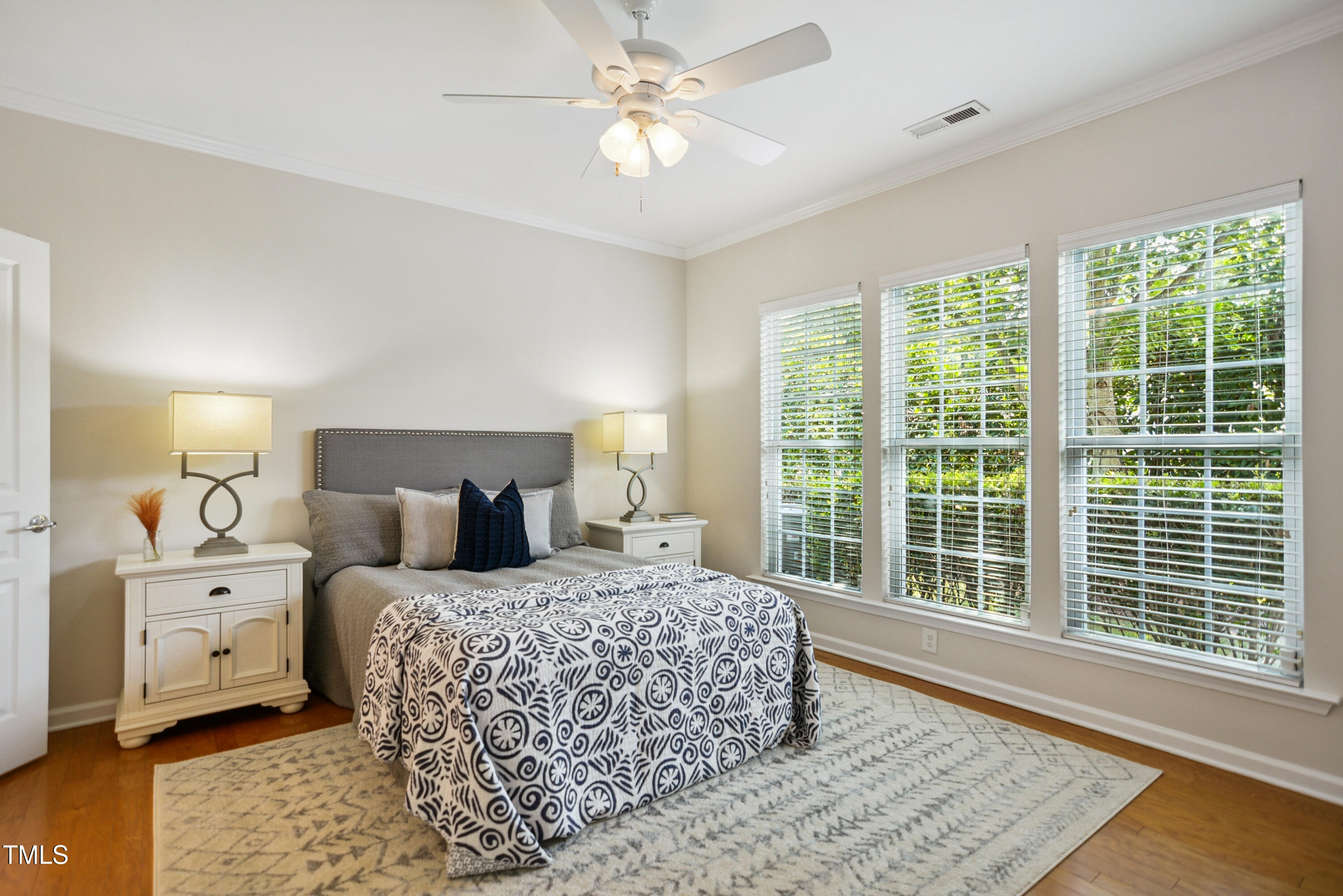 563 Tomkins Loop Cary, NC 27519 - Photo 13 of 26 a bedroom with a large bed and a window