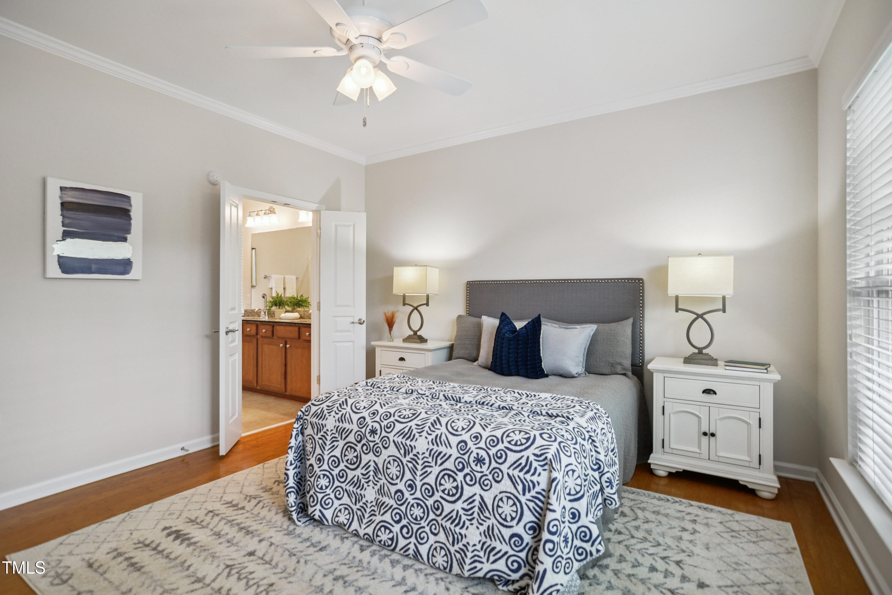 563 Tomkins Loop Cary, NC 27519 - Photo 14 of 26 a bedroom with a bed and a chandelier
