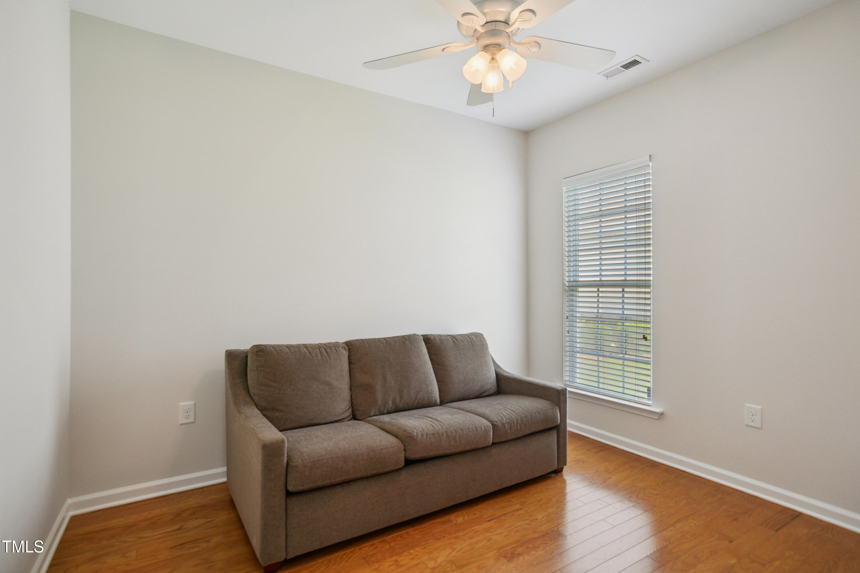 563 Tomkins Loop Cary, NC 27519 - Photo 17 of 26 a living room with furniture and a window