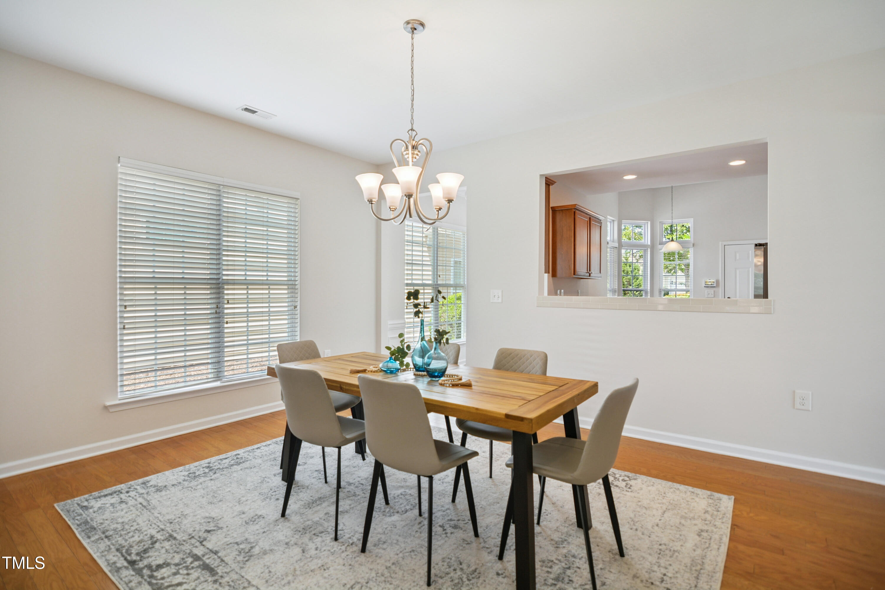 563 Tomkins Loop Cary, NC 27519 - Photo 3 of 26 a dining room with furniture and wooden floor