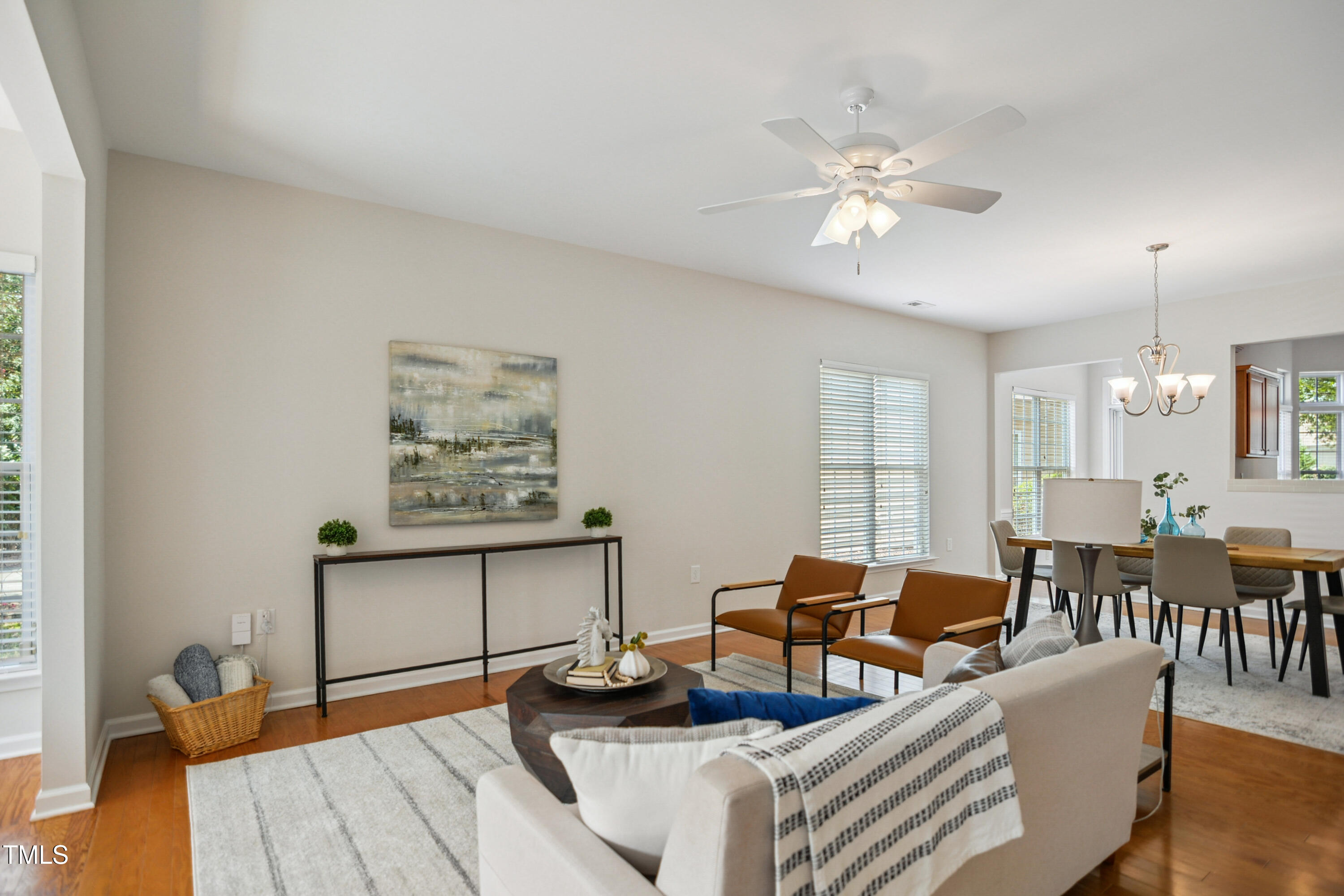 563 Tomkins Loop Cary, NC 27519 - Photo 6 of 26 a living room with furniture and wooden floor