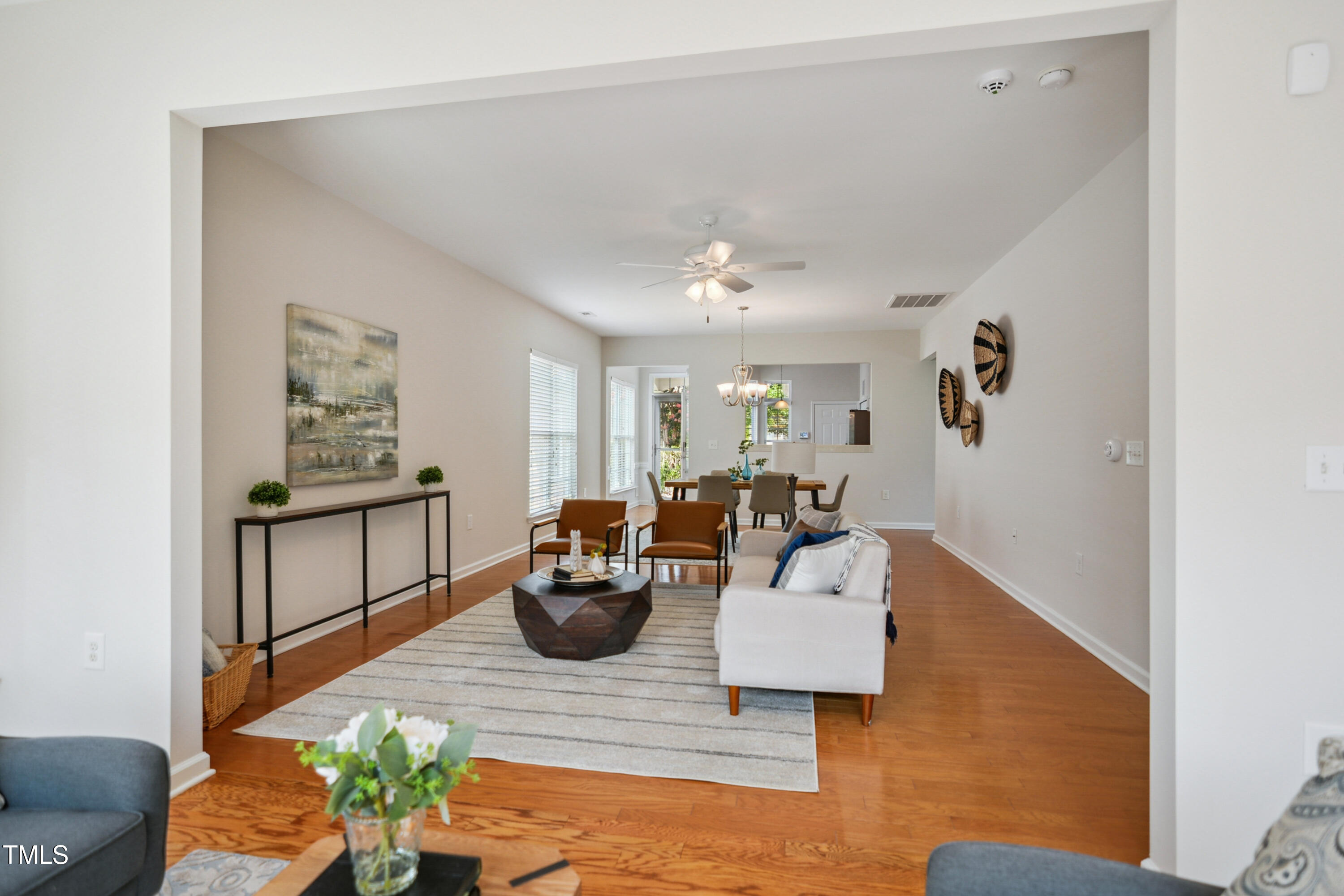 563 Tomkins Loop Cary, NC 27519 - Photo 8 of 26 a living room with furniture and a potted plant