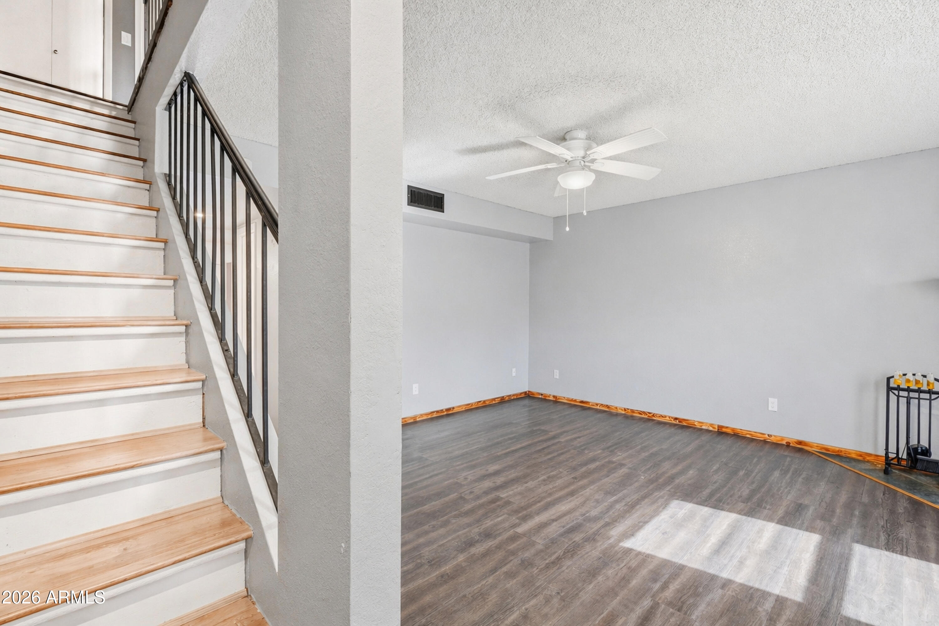 6262 East Brown Road, Unit 10 Mesa, AZ 85205 - Photo 12 of 33 wooden floor in an empty room with a window