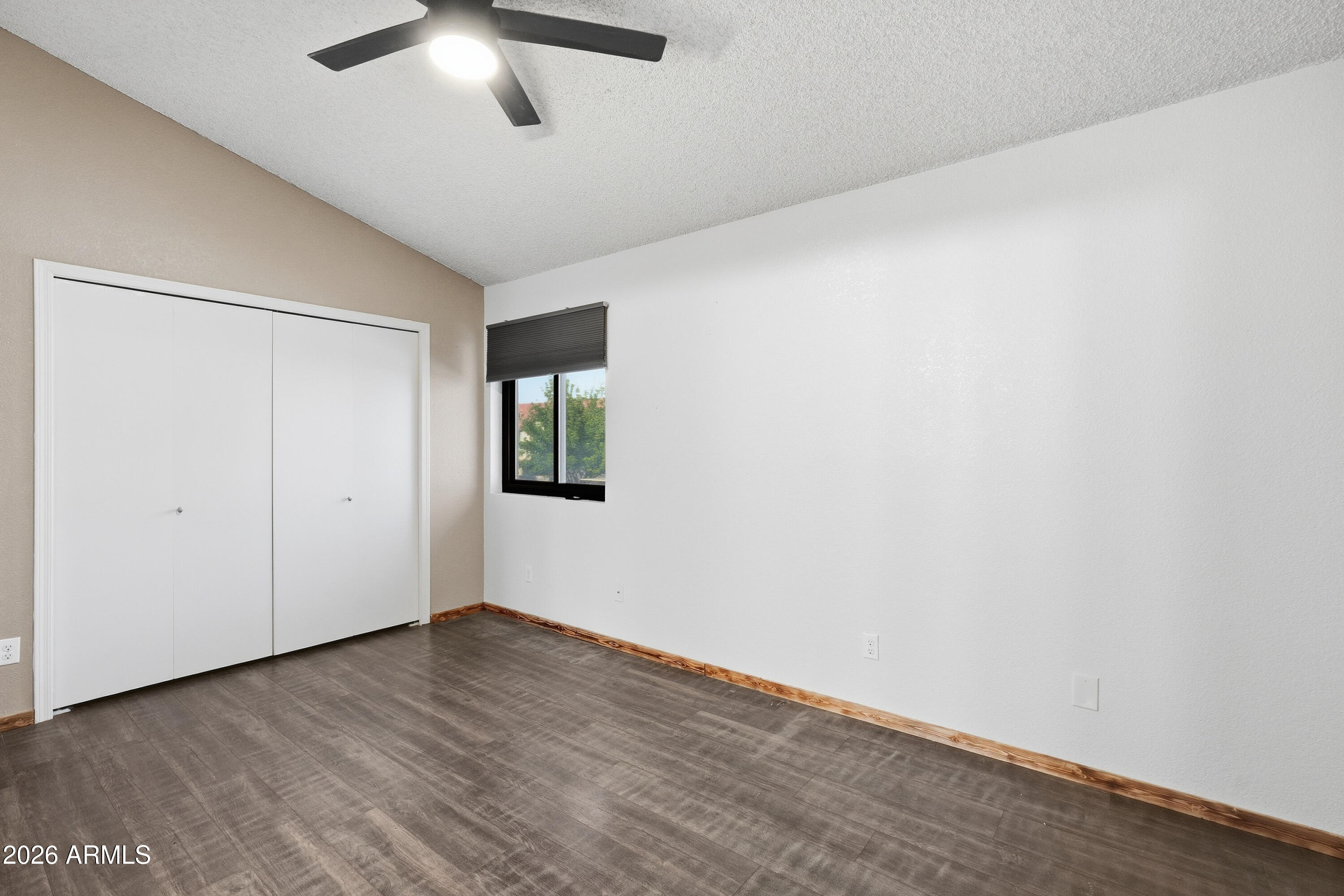 6262 East Brown Road, Unit 10 Mesa, AZ 85205 - Photo 16 of 33 a view of an empty room with wooden floor