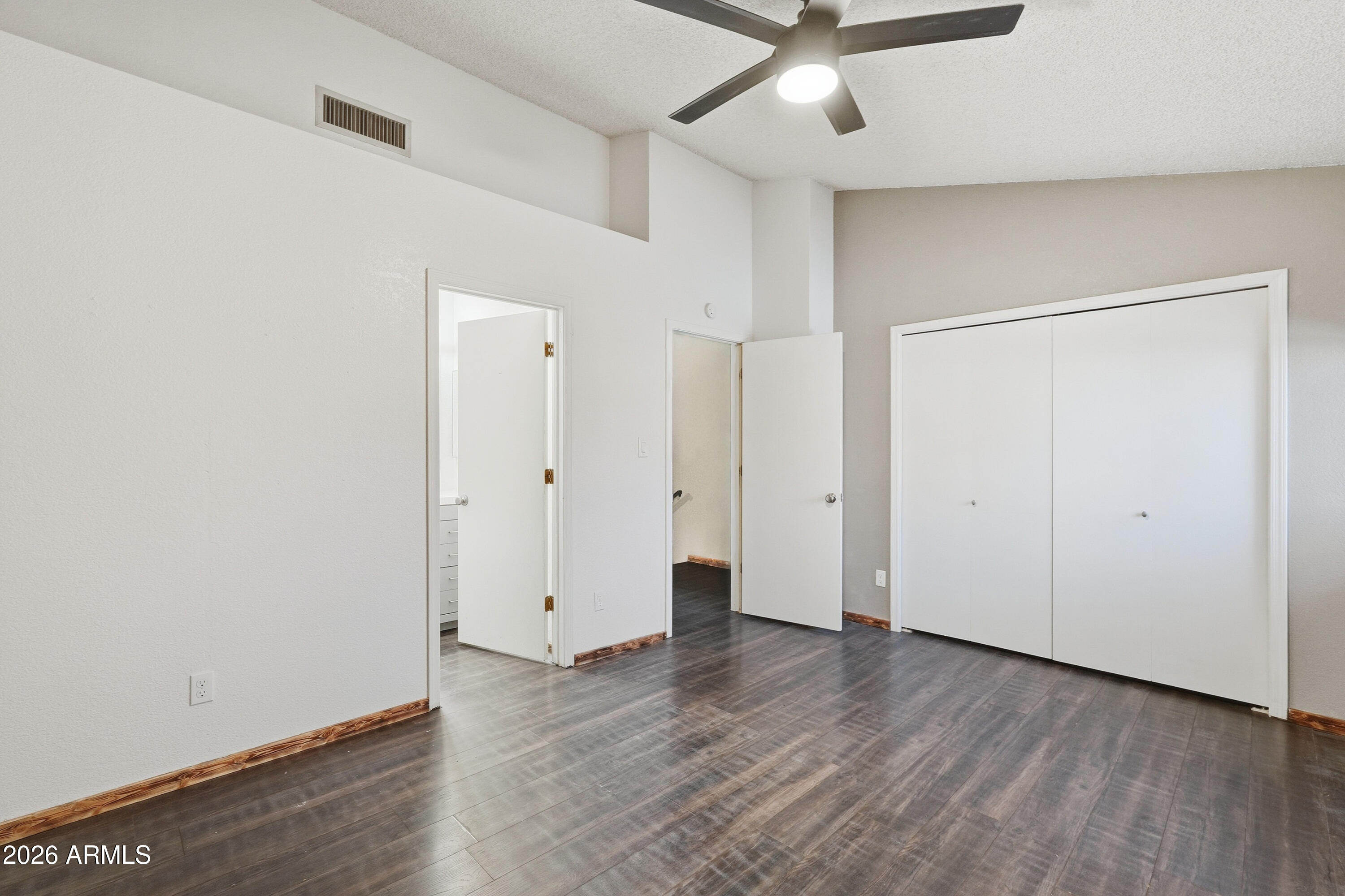 6262 East Brown Road, Unit 10 Mesa, AZ 85205 - Photo 17 of 33 a view of an empty room with wooden floor