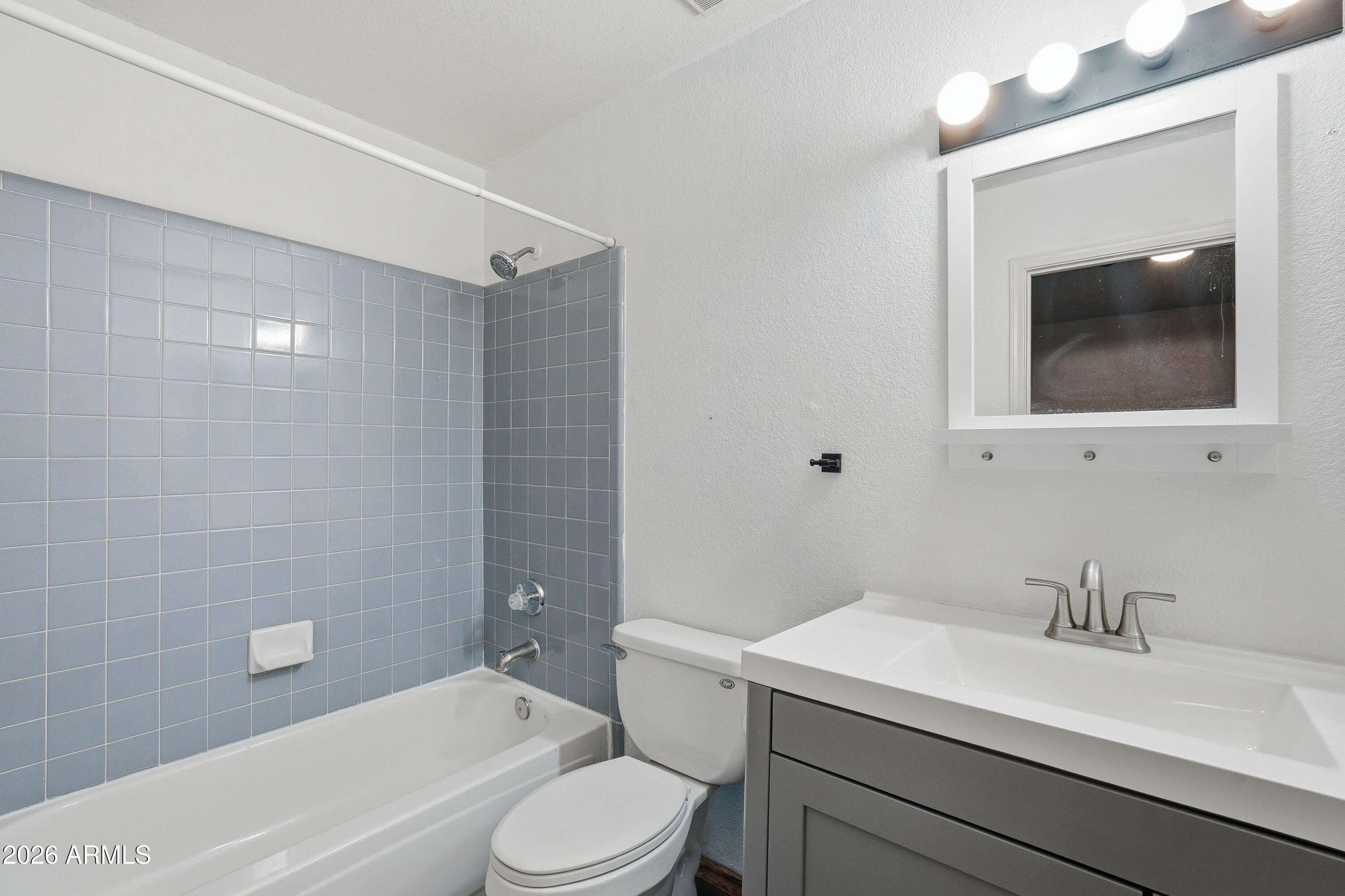 6262 East Brown Road, Unit 10 Mesa, AZ 85205 - Photo 26 of 33 a bathroom with a sink a toilet and shower