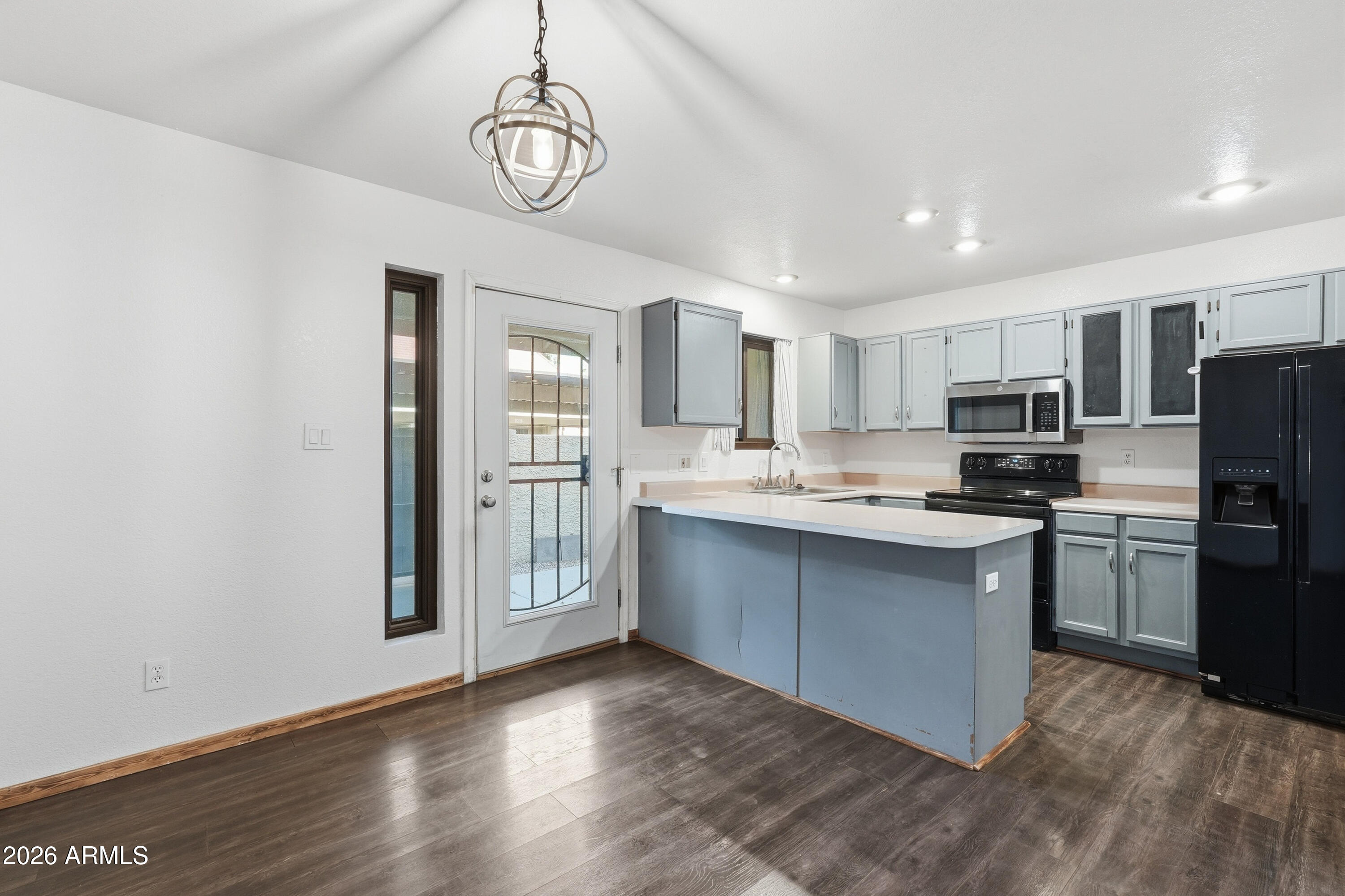 6262 East Brown Road, Unit 10 Mesa, AZ 85205 - Photo 6 of 33 a kitchen with stainless steel appliances granite countertop a refrigerator a stove top oven a sink and dishwasher