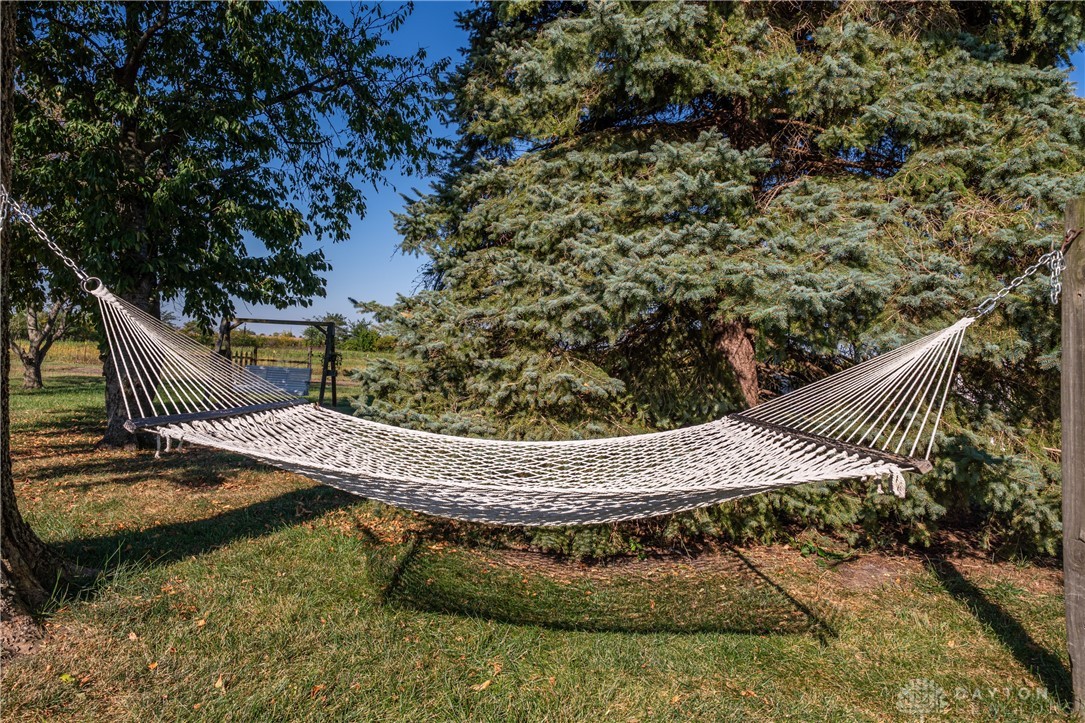 1599 Garringer Road Jamestown, OH 45335 - Photo 38 of 73 Relax outdoors in this tranquil yard, featuring a comfortable hammock for peaceful moments.