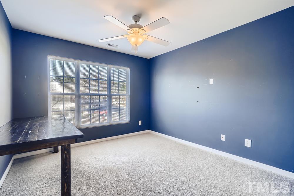 7012 Racine Way Raleigh, NC 27690 - Photo 19 of 28 a view of an empty room with a window