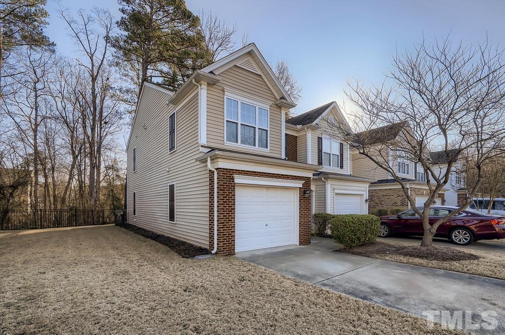 7012 Racine Way Raleigh, NC 27690 - Photo 2 of 28 a view of a house with a large space in front of a house