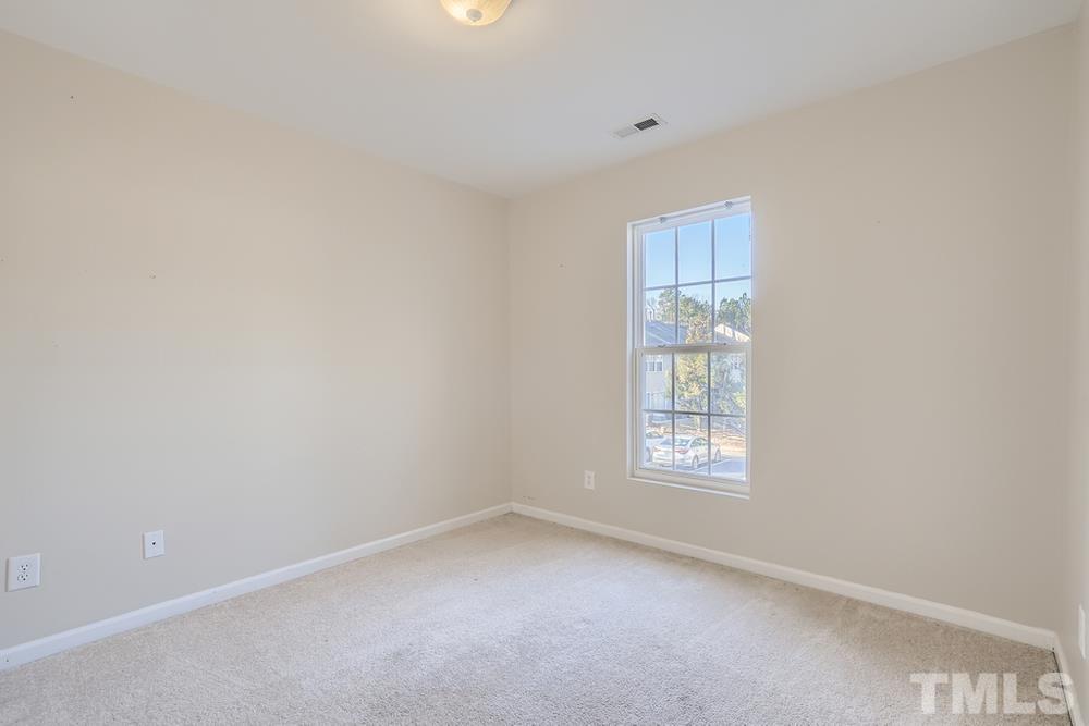 7012 Racine Way Raleigh, NC 27690 - Photo 21 of 28 a view of empty room with windows
