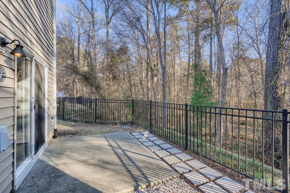 7012 Racine Way Raleigh, NC 27690 - Photo 26 of 28 a view of a balcony with a pot on the wall