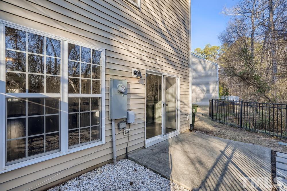 7012 Racine Way Raleigh, NC 27690 - Photo 27 of 28 a view of front door with wooden fence