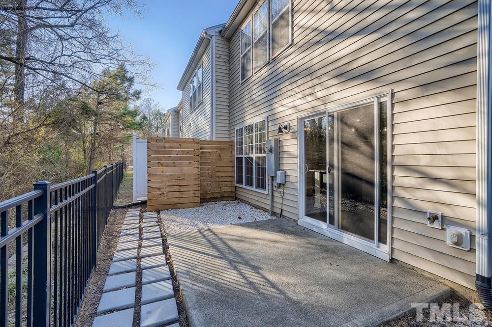 7012 Racine Way Raleigh, NC 27690 - Photo 28 of 28 a view of a house with a wooden fence