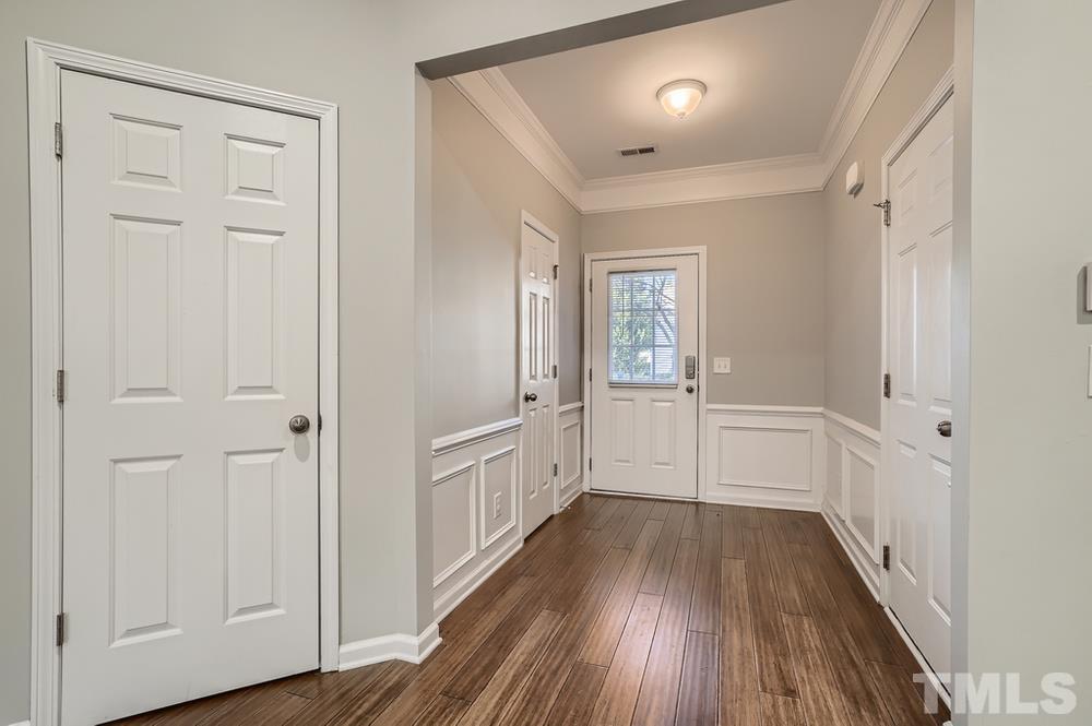 7012 Racine Way Raleigh, NC 27690 - Photo 4 of 28 wooden floor with white walls
