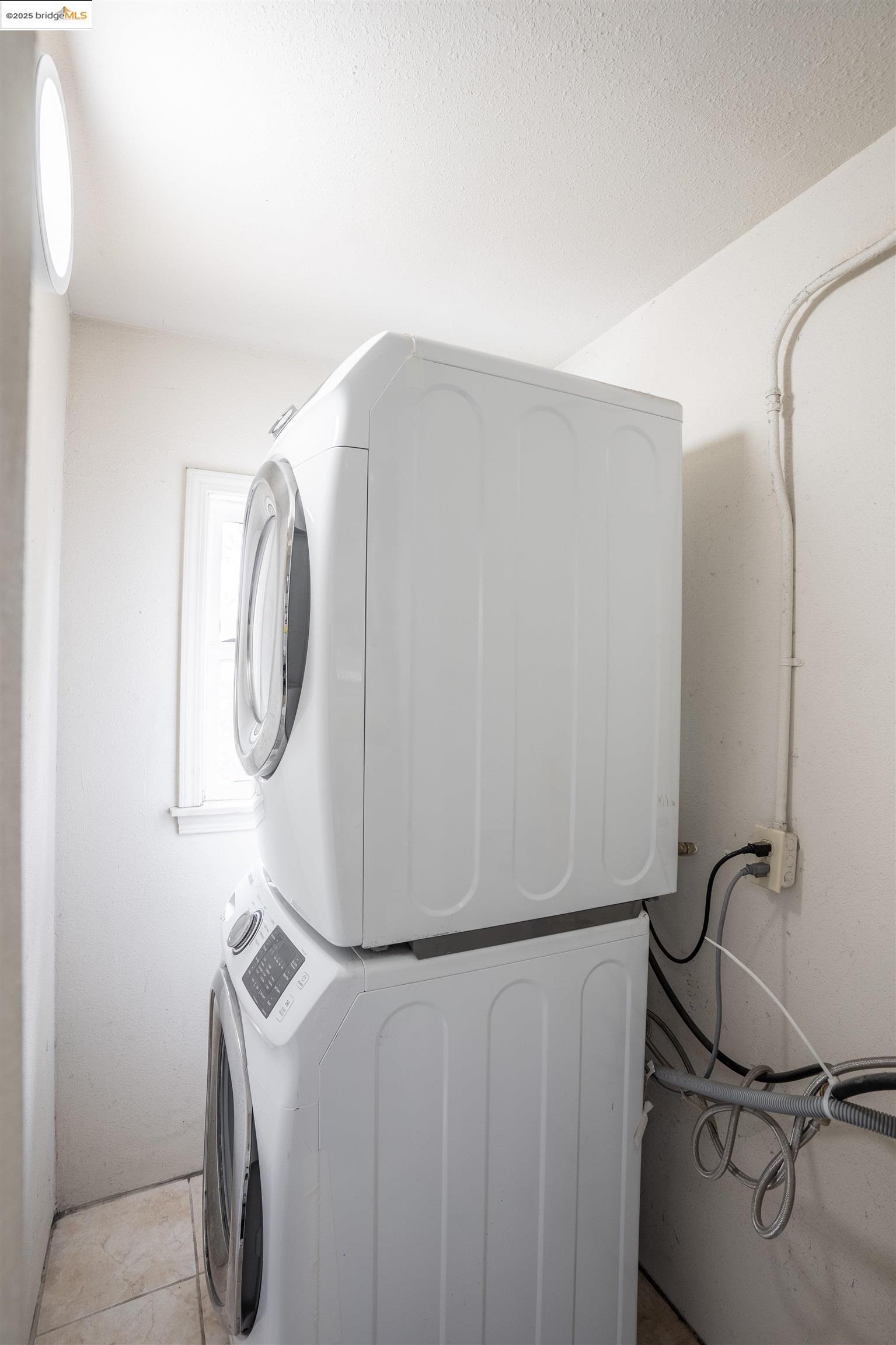 527 Chester Street Oakland, CA 94607 - Photo 22 of 59 Laundry area featuring stacked washer / drying machine
