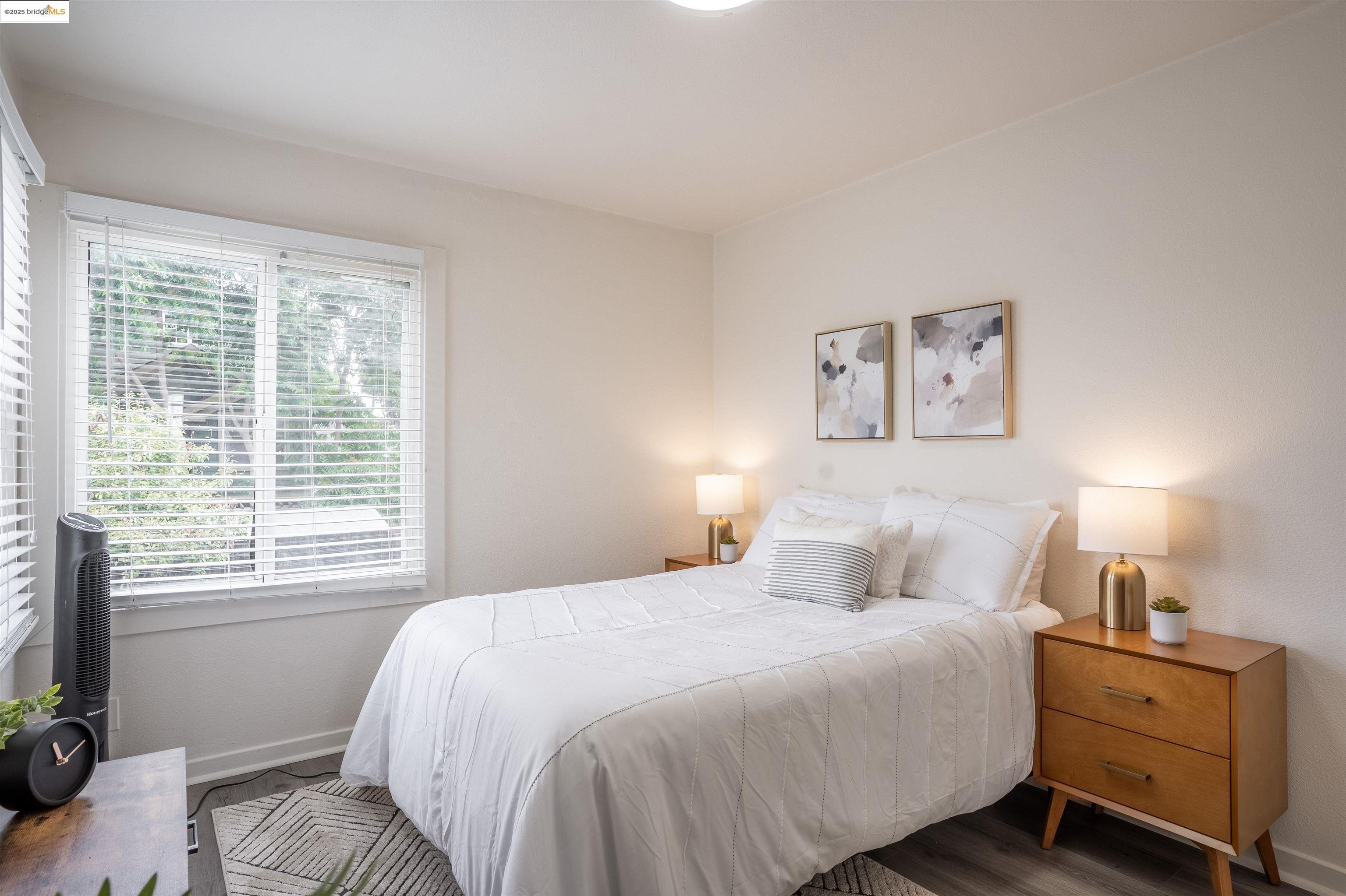 527 Chester Street Oakland, CA 94607 - Photo 42 of 59 Bedroom featuring baseboards and wood finished floors