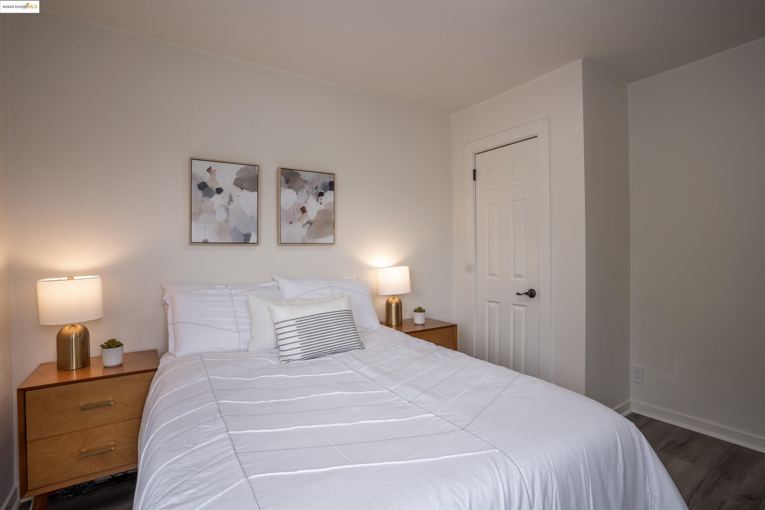 527 Chester Street Oakland, CA 94607 - Photo 44 of 59 Bedroom featuring baseboards and dark wood-style flooring