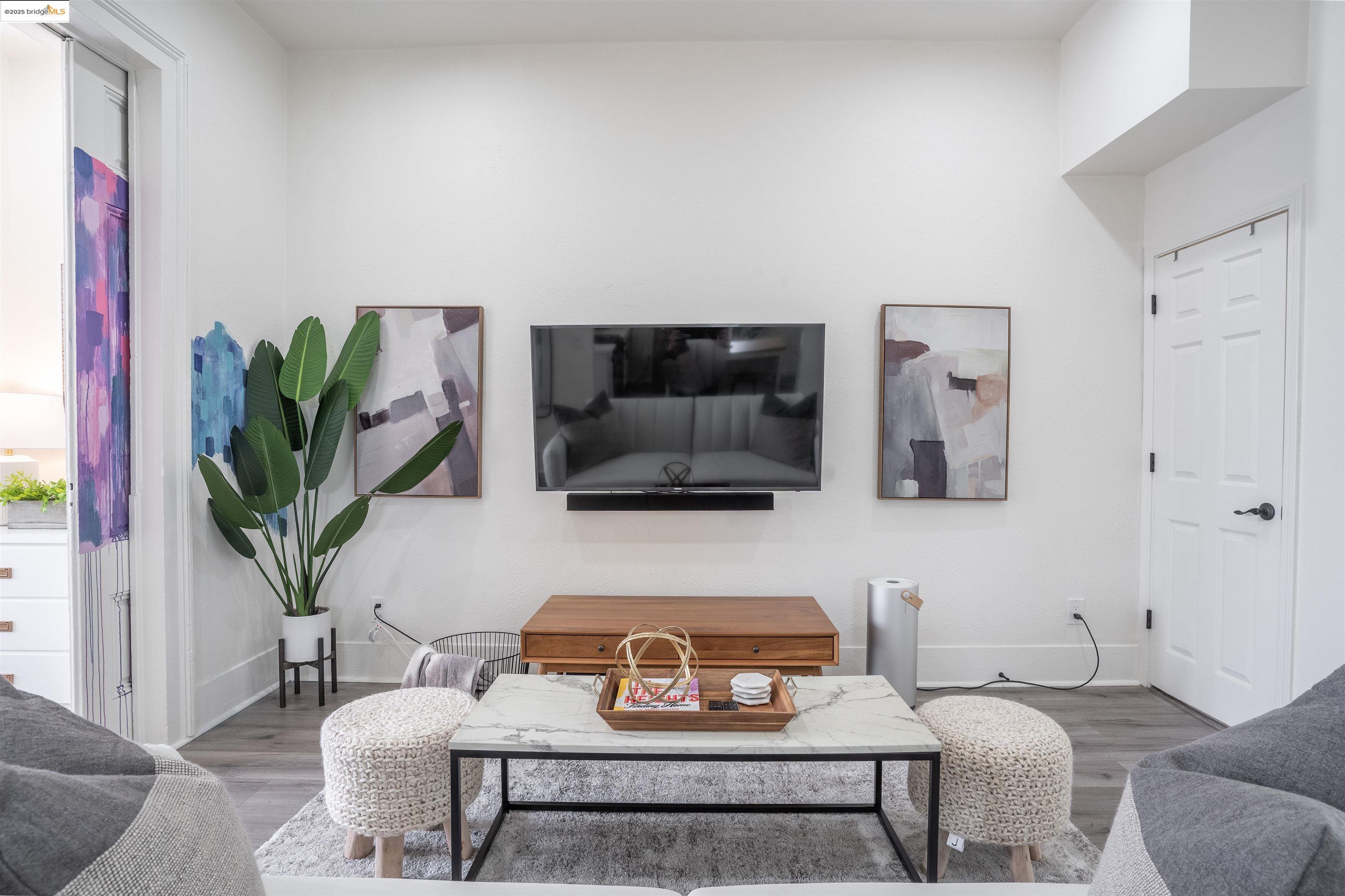 527 Chester Street Oakland, CA 94607 - Photo 46 of 59 Living room with wood finished floors and baseboards