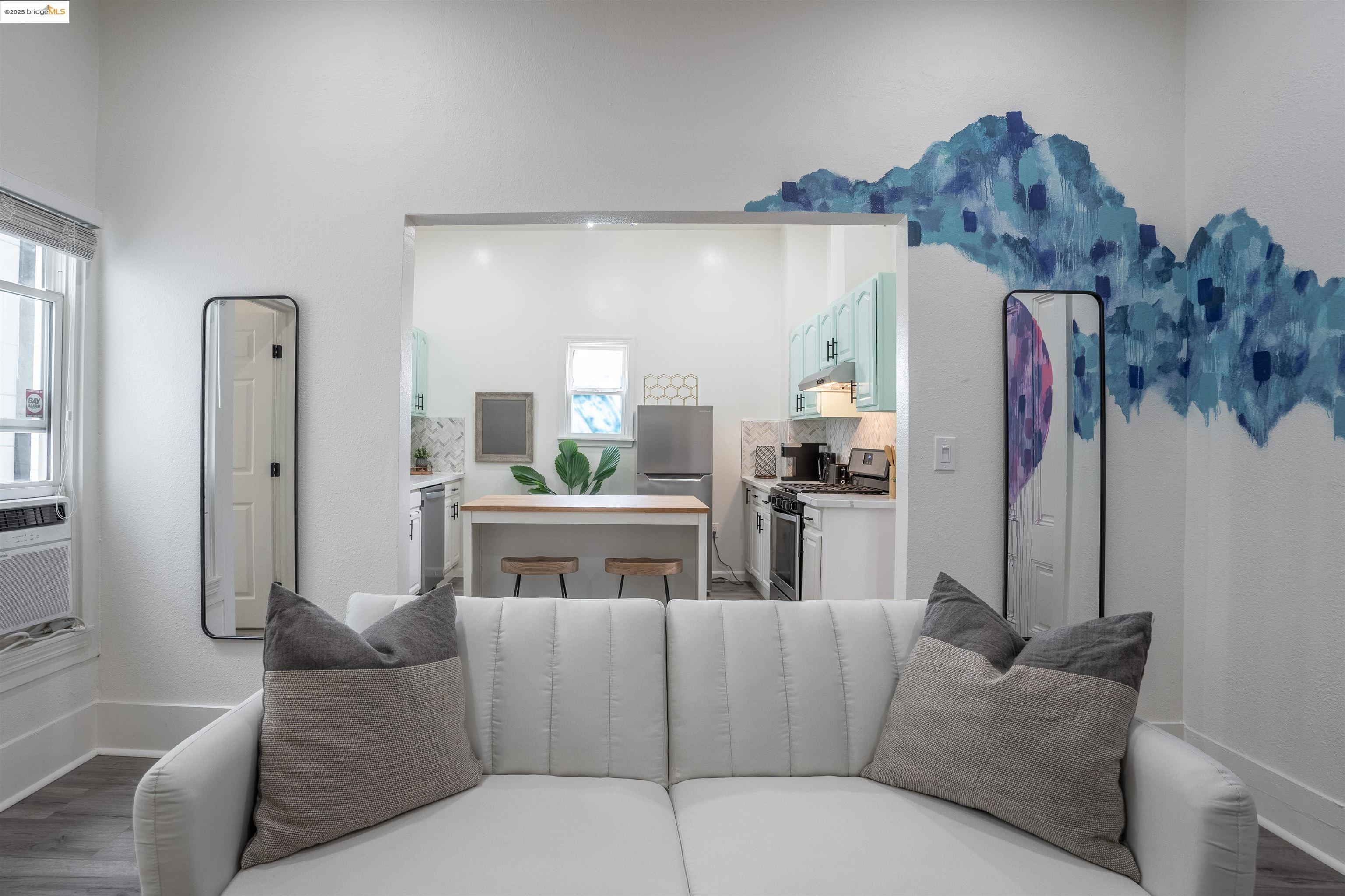 527 Chester Street Oakland, CA 94607 - Photo 53 of 59 Living room featuring baseboards and dark wood-type flooring