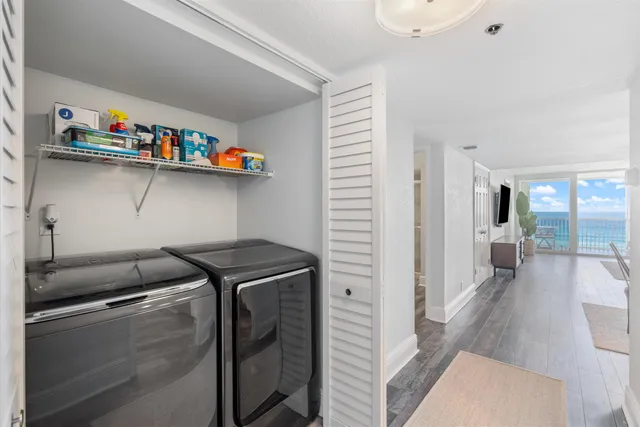 a view of a livingroom with furniture and a window
