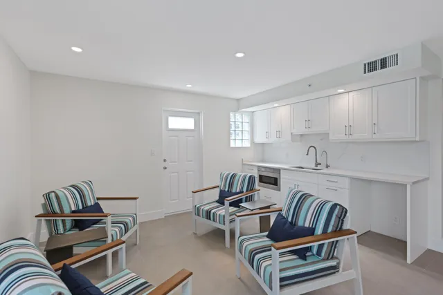 a view of a swimming pool with an outdoor seating