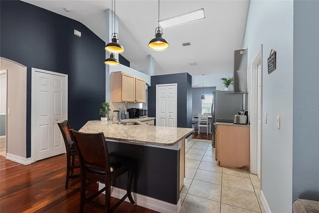 a view of kitchen with furniture and wooden floor