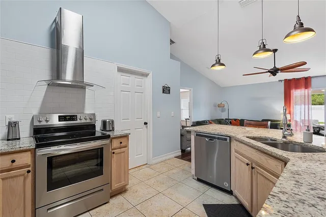 a kitchen with a stove and a sink