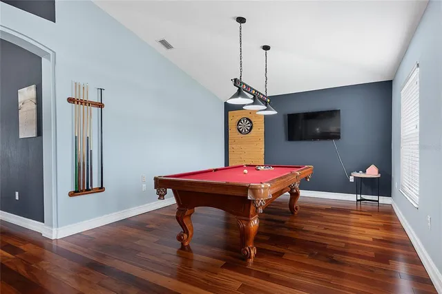 a room with furniture and wooden floor