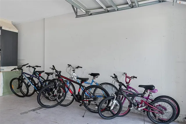 a front view of a house with a garden and plants