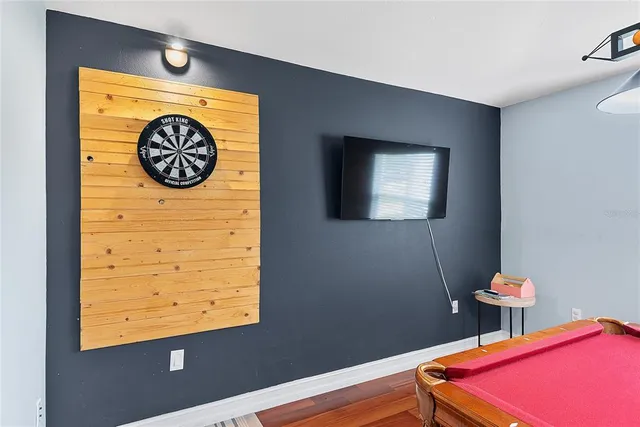 a view of a room with a table and chairs