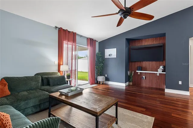 a living room with furniture and a window