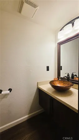 a room with a sink and a mirror