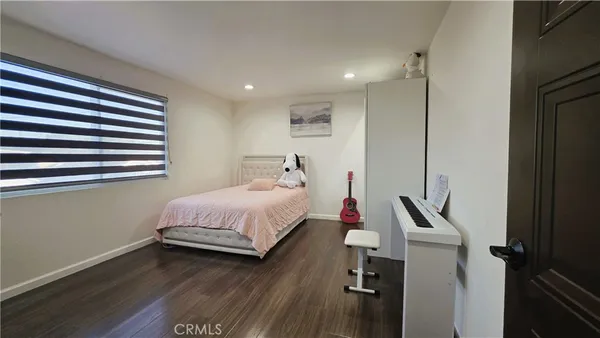 a bed room with a bed and a window
