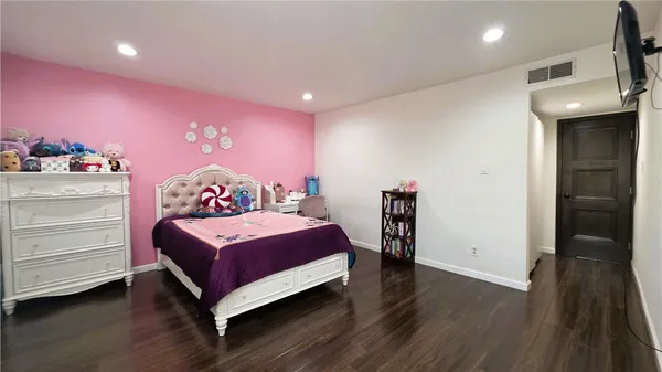 a bedroom with a bed and a closet