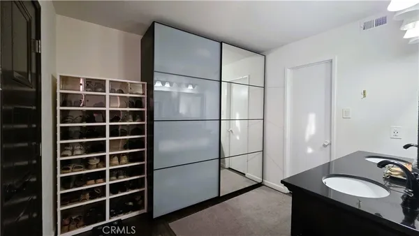 a bathroom with a shower and a sink