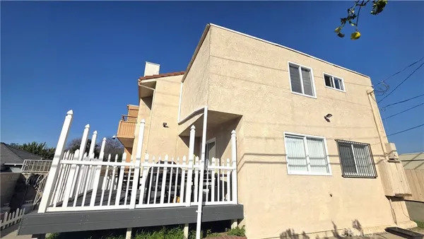 a view of balcony with two chairs and wooden floor