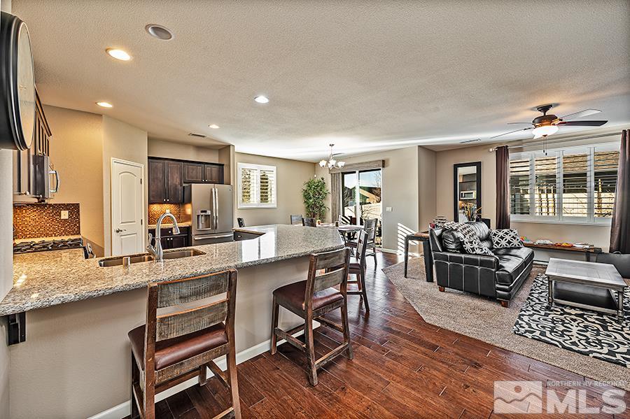 2201 Dominic Drive Reno, NV 89521 - Photo 4 of 20 a large kitchen with a table and chairs