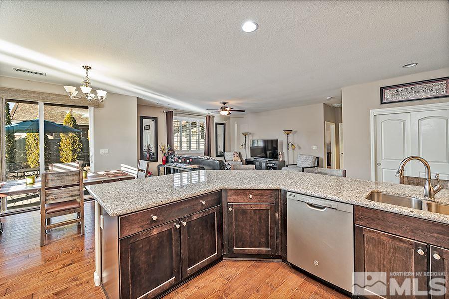2201 Dominic Drive Reno, NV 89521 - Photo 7 of 20 a kitchen with a sink stove and cabinets