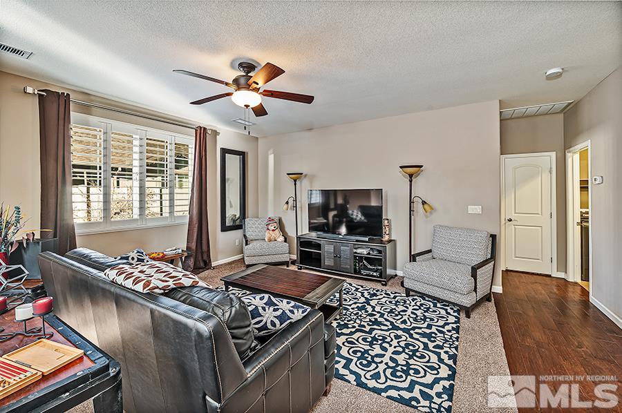 2201 Dominic Drive Reno, NV 89521 - Photo 9 of 20 a living room with furniture and a flat screen tv